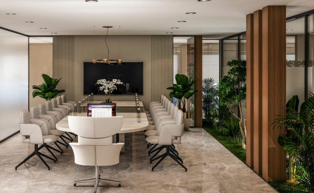Contemporary office boardroom with long meeting table and plants